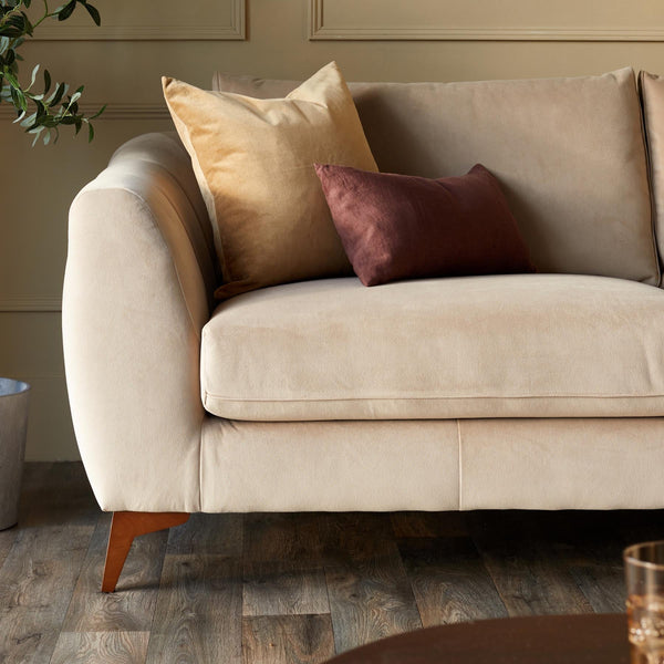 Genevieve champagne velvet 3 seater sofa with wooden leg