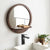Marley round mirror with mango wood shelf